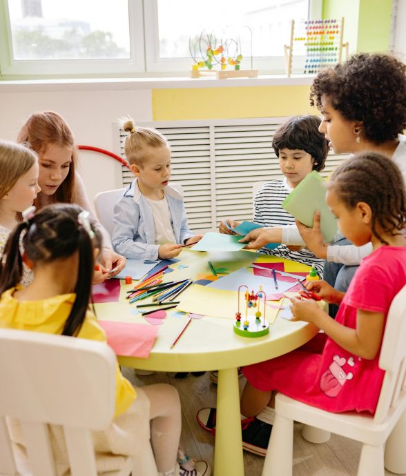 Children engaged in creative activities during an art class at a preschool, fostering learning and fun.