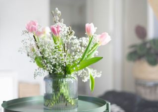 Elegant armchair and decor in a detailed interior setting with soft lighting.